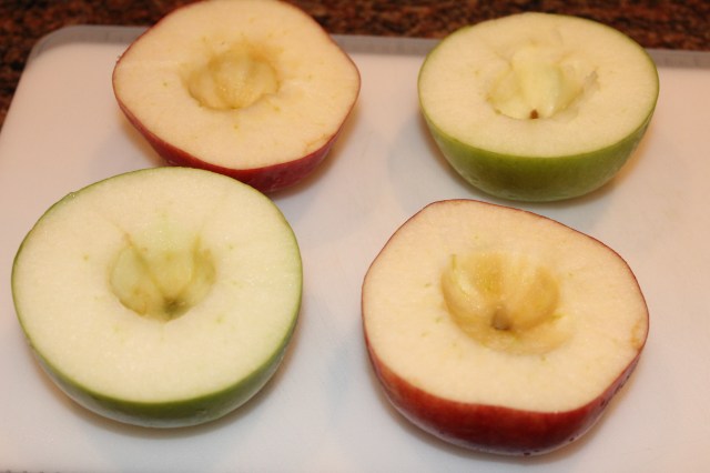 Slice apples in half and core