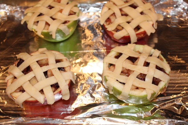 Top apples with dough strips