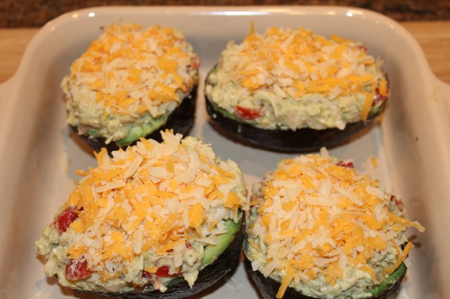 Top Kel's chicken stuffed avocados with cheese
